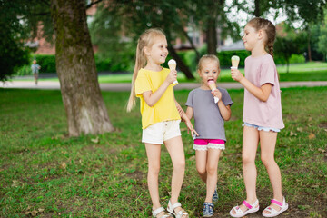 Children licking ice cream refreshing in the park. Ice Cream Summer Refreshment
