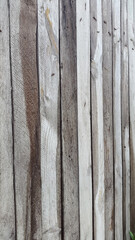 Panel made of boards. Wooden fence. Vintage plank background