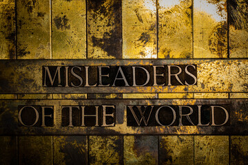 Misleaders Of The World text on grunge textured copper and gold background