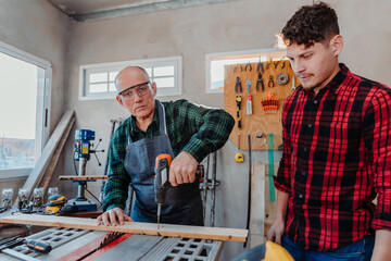 father and son in their carpentry workshop