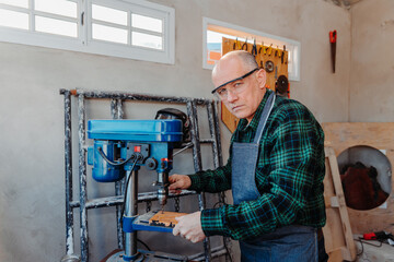 adult man using bench drill