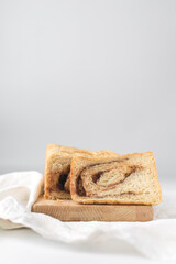 Chocolate filled bread, filled bread that did not rise properly because of too much filling, underbaked bread, lopsided dough, bread stuffed with chocolate