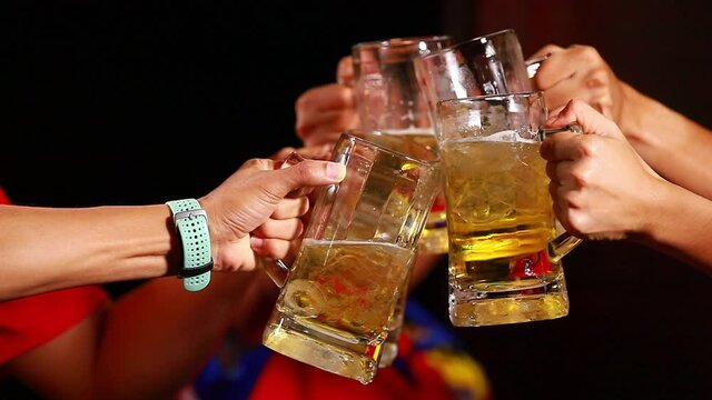 friends clinking beer glasses Slow motion 