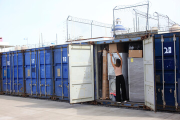 woman fills a storage container