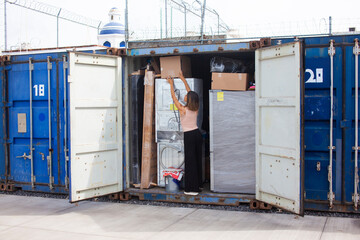 woman fills a storage container