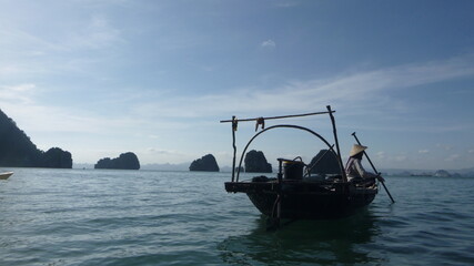 Fototapeta na wymiar Fisherman on a boat, Vietnam, Southeast Asia, sea