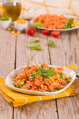 Fusilli pasta with peas and sweet corn.