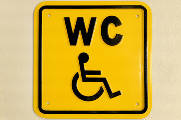 A WC signpost for disabled people.