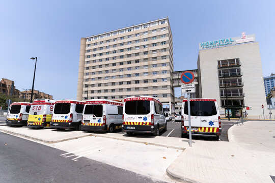 Valencia, Spain -July 24, 2021: Main facade with ambulance parking in the foreground of the "Arnau de Vilanova" Public Hospital in Valencia