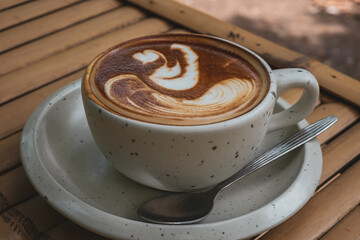 Cappuccino Recipe Mug, espresso based coffee drink traditionally prepared with steamed milk foam, concept background in retro vintage natural garden showing the lifestyle design and creative time