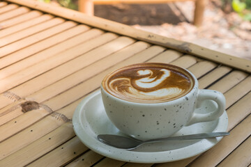 Cappuccino Recipe Mug, espresso based coffee drink traditionally prepared with steamed milk foam, concept background in retro vintage natural garden showing the lifestyle design and creative time