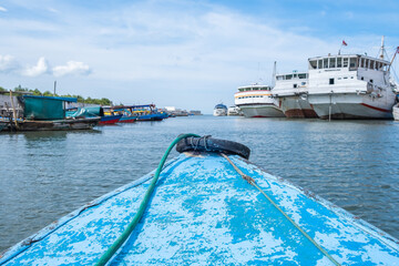 Boating with small wooden ship along in Sunda Kelapa Port, Jakarta for the vacation leisure