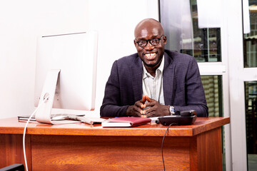 Fototapeta premium portrait of a handsome adult businessman smiling in office.