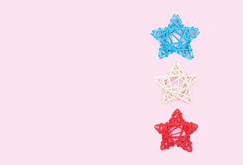 Decoration of wicker star made of rattan on pink background