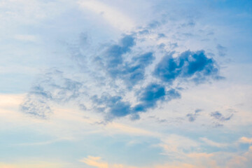 Evening summer blue sky and a cumulus cloud resembling the image of a kind dragon