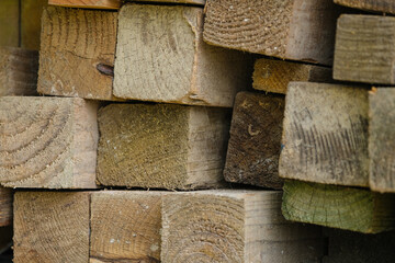 Stacks of planks of timber hard wood stacked on top of each other