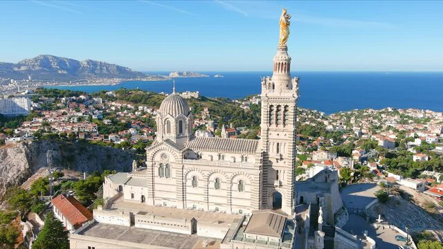 Marseille: Aerial view of city in France, basilica Basilique Notre-Dame de la Garde (la Bonne-m&egrave;re) on top of hill - landscape panorama of Europe from above