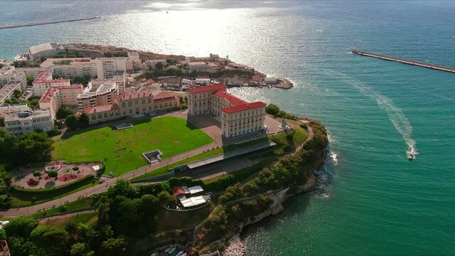 Marseille: Aerial view of city in France, palace Palais du Pharo and Parc &Eacute;mile Duclaux surrounded by waters of Mediterranean Sea at sunset - landscape panorama of Europe from above