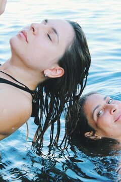 Portrait Of Two Friends At The Sea Letting Wet Hair Down 