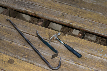 Repairing old wooden deck showing required tools