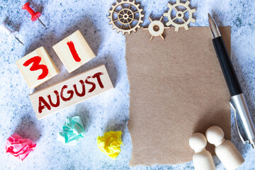 August 31th. Image of august 31 wooden color calendar on blue background. Last Summer day.