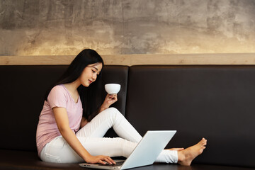 woman using laptop in bed home. Freelance.Work home online