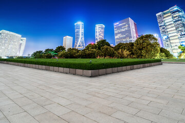 Square Brick Pavement and Night Scene of Modern Architecture