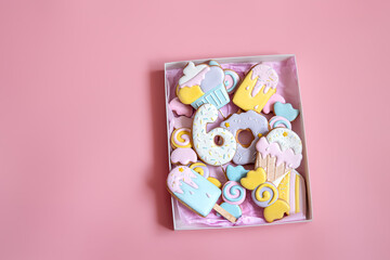 Flat lay box with colorful gingerbread cookies for children.