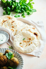 Antipasto wooden plate with cheese, grapes, meat sticks.