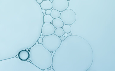 Oil bubble created pattern and circle shape with light blue gradient effects.