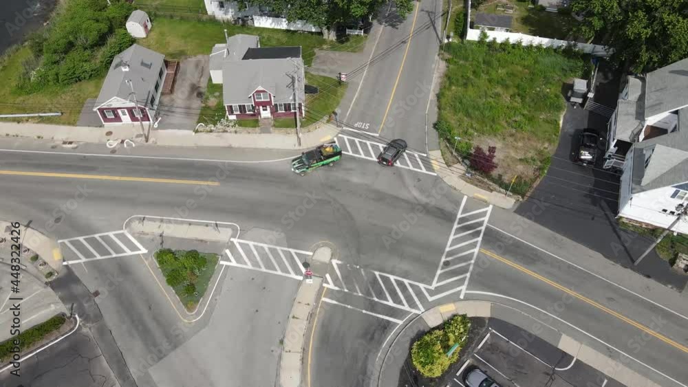 Aufkleber aerial birds eye view of suburban multiway intersection. long clip, constant stream of traffic. dron