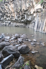 The Hexagon Pool is a natural pool in the Meshushim Reserve, in the central Golan Heights, Israel. The pool is named after the shape of the hexagonal basalt columns that that make up its walls