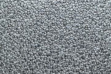 Black grain background. Gray wall for board background. Grey styrofoam foam texture or white plastic polystyrene pattern.