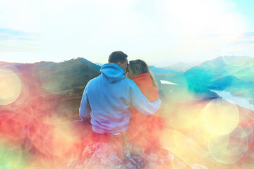 couple hugging in mountains landscape, romance happiness adventure together active