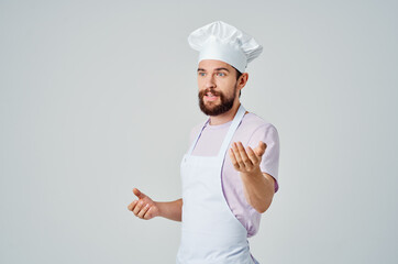 Cheerful bearded man gesturing with hands cooking food preparation restaurant industry
