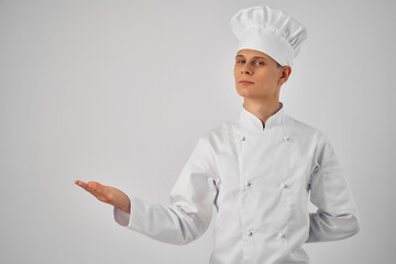 a man in a chef's uniform gesturing with his hand work professional cooking