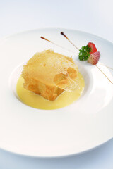 deep fried crispy golden premium durian dessert with yellow sauce in white background asian halal menu