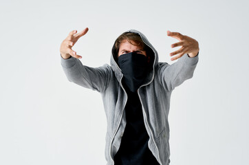 masked man with hood anonymity theft hacking