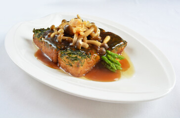 braised handmade spinach vegetable bean curd tofu with mushroom in oyster sauce in white background asian halal menu