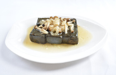 braised home made charcoal bean curd tofu with mushroom in oyster sauce in white background asian halal menu