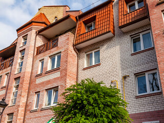 Fototapeta na wymiar Zelenogradsk, Russia, June 28, 2021. Architectural ensemble in the area of ​​historical urban development. Typical fragment of facade