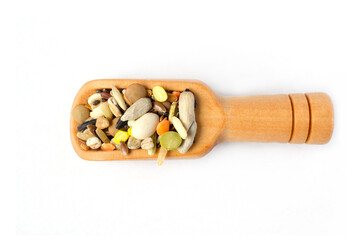 Group of dry organic mixed cereal and grain seed in little wooden scoop on white background. Concept of healthy food ingredient or agricultural product concept