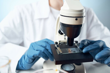woman scientist laboratory microscope research