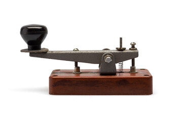 Telegraph key or Morse key isolated on white background. Vintage Morse code telegraphy device side view. - obrazy, fototapety, plakaty