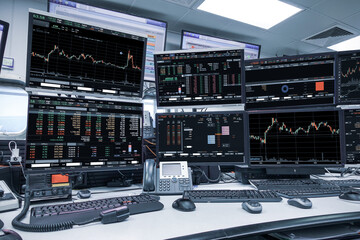 group of stock data monitor analyzing data stock market in monitoring room on the data presented in the chart, forex trading graph, stock exchange trading online, financial investment
