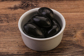 Pickled black olives in the bowl