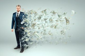 A man a businessman in a suit dissolves, crumbles into dust, money flies out of his body. Concept Bankruptcy, unprofitable business, loan, mortgage, leasing, debt. - obrazy, fototapety, plakaty