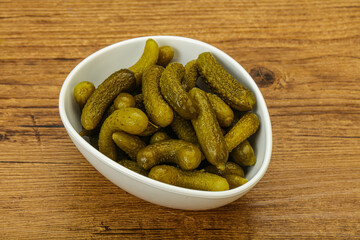 Pickled gherkin in the bowl