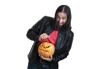A man with a beard and long hair in a black jacket with a pumpkin in his hands posing on a white background. Various poses and emotions. Halloween concept. 