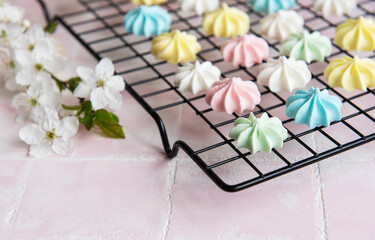 Multicolored meringue on a baking rack